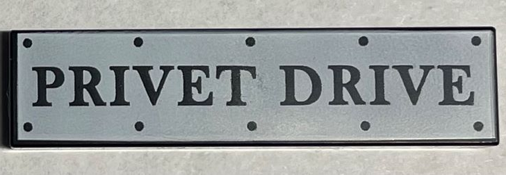 Tile 1 x 4 with Road Sign with 'PRIVET DRIVE' and Rivets on White Background Pat - Black